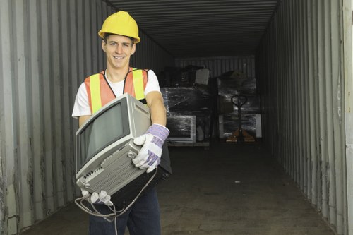 Workers sorting recyclables during a flat clearance operation